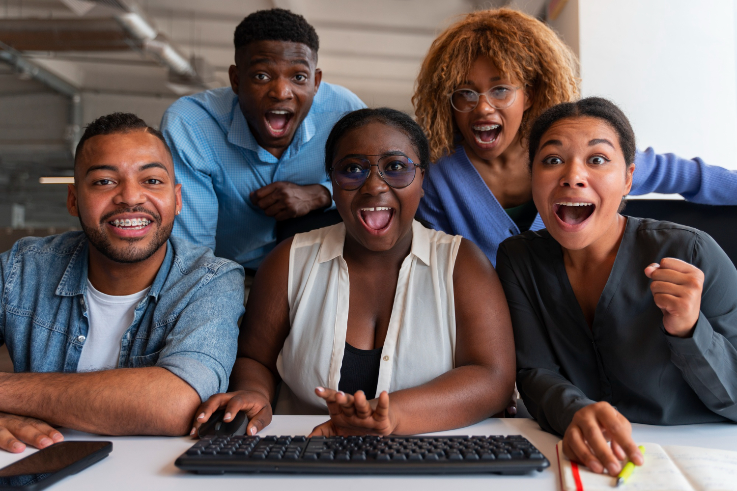 black mates in office smiling and laughing